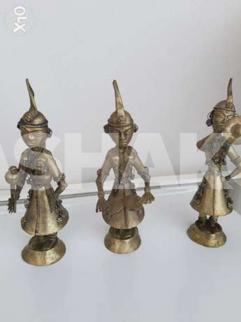 Three decorative statues in copper